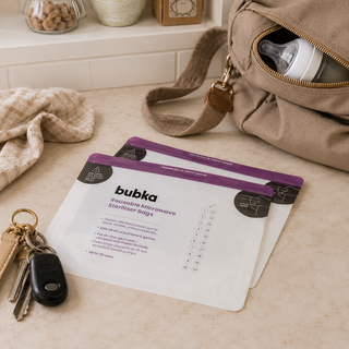 Bubka reusable microwave sterilizer bags on a surface with a bag, keys, and a bottle in the background.