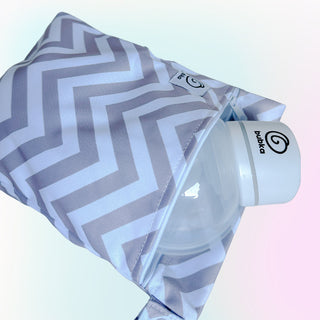 BPA-free water bottle with a gray and white zigzag patterned sleeve on a light background